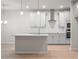 Modern kitchen with island, stainless steel appliances, and light gray cabinets at 1032 Rose Dr, Marietta, GA 30060
