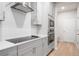 Modern kitchen with stainless steel appliances and white cabinets at 1032 Rose Dr, Marietta, GA 30060