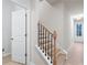 Modern staircase with black spindles and light wood treads at 1032 Rose Dr, Marietta, GA 30060