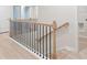 Upper-level view of staircase with black railing at 1032 Rose Dr, Marietta, GA 30060