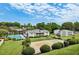 Community overview featuring pool, volleyball court, and lush landscaping at 1150 Collier Nw Rd # J15, Atlanta, GA 30318