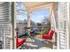 Private balcony with red chairs and views of the community at 1150 Collier Nw Rd # J15, Atlanta, GA 30318