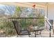 Private balcony with wooded views and seating for two at 1150 Collier Nw Rd # J15, Atlanta, GA 30318