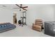Multi-purpose bedroom with a daybed, recliner, and home gym equipment at 1150 Collier Nw Rd # J15, Atlanta, GA 30318