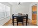 Bright dining area with four-person table and hardwood floors at 1150 Collier Nw Rd # J15, Atlanta, GA 30318