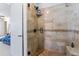 Large walk-in shower with glass enclosure and neutral tile at 1150 Collier Nw Rd # J15, Atlanta, GA 30318