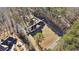 House with pool and large lot, surrounded by trees at 157 Timberlost Trl, Suwanee, GA 30024
