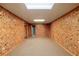 Finished basement with neutral carpeting and walls at 157 Timberlost Trl, Suwanee, GA 30024