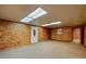 Finished basement with neutral carpeting and walls at 157 Timberlost Trl, Suwanee, GA 30024
