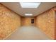 Finished basement with neutral carpeting and walls at 157 Timberlost Trl, Suwanee, GA 30024