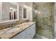 Updated bathroom with granite countertops and walk-in shower at 157 Timberlost Trl, Suwanee, GA 30024