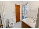 Clean bathroom with wood vanity and tiled floor at 157 Timberlost Trl, Suwanee, GA 30024