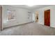 Bright bedroom featuring neutral carpeting and two windows at 157 Timberlost Trl, Suwanee, GA 30024