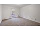 Simple bedroom with neutral carpeting and large window at 157 Timberlost Trl, Suwanee, GA 30024