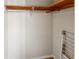 Closet with wooden shelves and a clothing rack at 157 Timberlost Trl, Suwanee, GA 30024