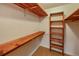 Large closet with wooden shelves and hanging rods at 157 Timberlost Trl, Suwanee, GA 30024