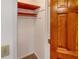 Small closet with wood shelving at 157 Timberlost Trl, Suwanee, GA 30024