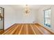 Formal dining room with hardwood floors and chandelier at 157 Timberlost Trl, Suwanee, GA 30024