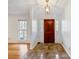Bright entryway with tile floors and wood door at 157 Timberlost Trl, Suwanee, GA 30024