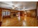 Gathering room with hardwood floors and brick fireplace at 157 Timberlost Trl, Suwanee, GA 30024