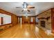 Gathering room with hardwood floors, fireplace and built-ins at 157 Timberlost Trl, Suwanee, GA 30024