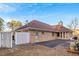 Brick house with brown roof, large backyard, and attached garage at 157 Timberlost Trl, Suwanee, GA 30024