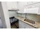 Updated kitchen with granite countertops and stainless steel appliances at 157 Timberlost Trl, Suwanee, GA 30024