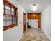 Laundry room with tile floor and built-in cabinets at 157 Timberlost Trl, Suwanee, GA 30024