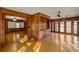 Bright living room with hardwood floors and ceiling fan at 157 Timberlost Trl, Suwanee, GA 30024