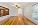 Spacious living area with hardwood floors and built-in shelving at 157 Timberlost Trl, Suwanee, GA 30024