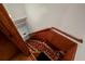 Wooden staircase with patterned carpet runner at 157 Timberlost Trl, Suwanee, GA 30024