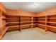 Finished basement storage room with wood shelving at 157 Timberlost Trl, Suwanee, GA 30024