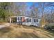 Ranch style house with red door and carport at 2329 Abner Nw Pl, Atlanta, GA 30318