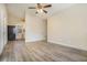 Living room with vinyl flooring, ceiling fan and kitchen view at 2329 Abner Nw Pl, Atlanta, GA 30318