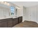 Bathroom with double vanity, neutral colors and vinyl flooring at 1601 Fuma Leaf Way, Mcdonough, GA 30253