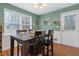 Dining area with four-chair table and access to backyard at 400 Fleeta Dr, Covington, GA 30016