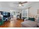 Relaxing living room with hardwood floors and a view into the dining area at 400 Fleeta Dr, Covington, GA 30016