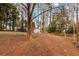 Spacious backyard with shed and wooded area at 4399 Plantation Ln, Norcross, GA 30093