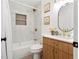 Modern bathroom with marble tile and gold fixtures at 4399 Plantation Ln, Norcross, GA 30093