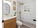 Modern bathroom with marble shower and gold fixtures at 4399 Plantation Ln, Norcross, GA 30093