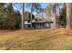 Gray exterior house with a white trim, and a large yard at 4399 Plantation Ln, Norcross, GA 30093