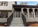 Modern front entrance with gray brick and dark wooden accents at 4399 Plantation Ln, Norcross, GA 30093