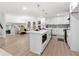 Modern white kitchen with a teal dishwasher and island at 4399 Plantation Ln, Norcross, GA 30093