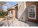 Back deck of a brick house with a large window and view of the yard with nearby trees at 8240 Knollbrook Ln, Mcdonough, GA 30253