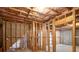 Unfinished basement featuring exposed wooden framework and insulation, offering a customizable space at 8240 Knollbrook Ln, Mcdonough, GA 30253