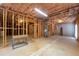 Partially finished basement with exposed framework, concrete flooring, and utilities at 8240 Knollbrook Ln, Mcdonough, GA 30253