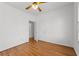 A bedroom with hardwood floors and white walls featuring two doorways at 8240 Knollbrook Ln, Mcdonough, GA 30253