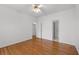 Bright bedroom with hardwood floors, a ceiling fan and two doorways at 8240 Knollbrook Ln, Mcdonough, GA 30253