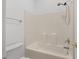 Standard white shower and tub with a shower head and faucet at 8240 Knollbrook Ln, Mcdonough, GA 30253