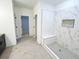 Modern bathroom with tiled shower, built-in seat, and decorative niche, all with neutral and white finishes at 1257 Pj East Rd, Covington, GA 30014